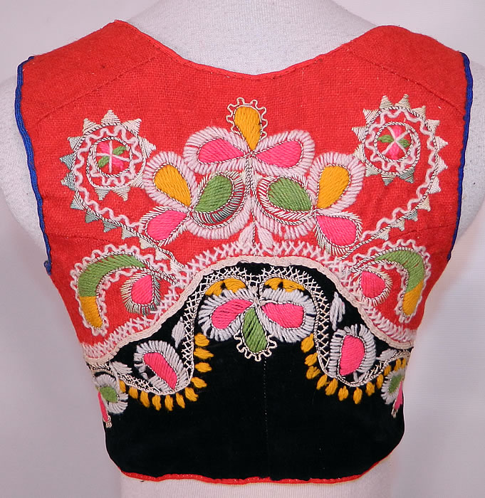 Vintage Portugese Folk Costume Embroidered Wool Vest Top. This pretty Portuguese folk costume vest top has a short cropped sleeveless style, with a squared neckline, front lacing closure and lined in cotton muslin fabric. 