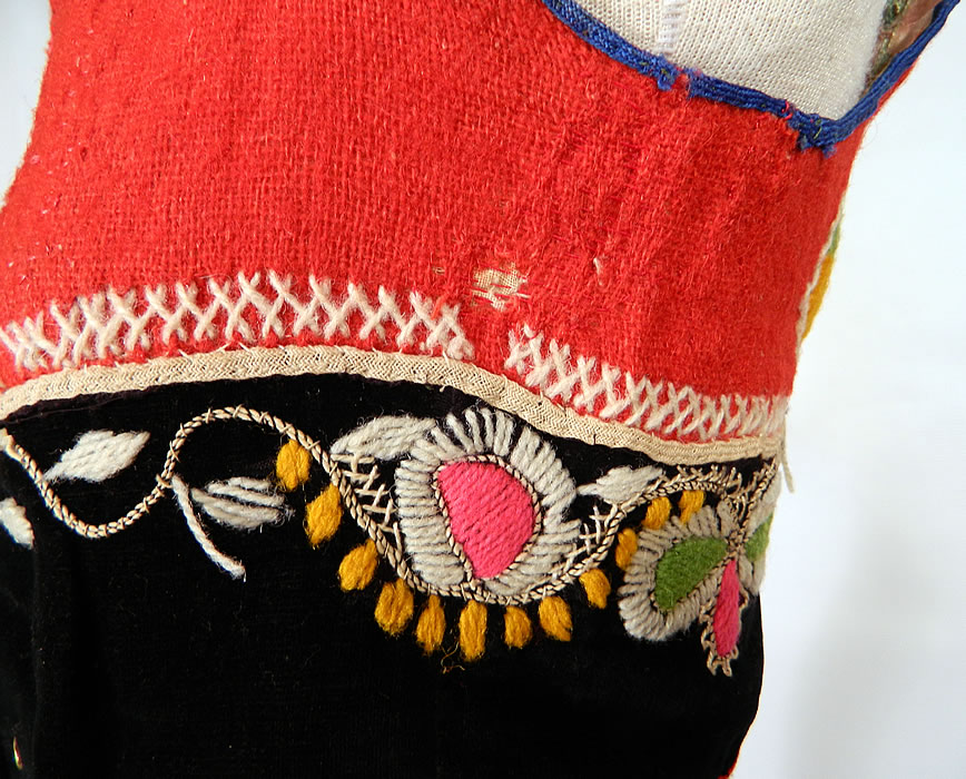 Vintage Portugese Folk Costume Embroidered Wool Vest Top. It has wonderful workmanship and hand done details. The vest is in good condition, with only a tiny moth nip hole on the side and underarm discoloration on the inside lining (see close-ups).  