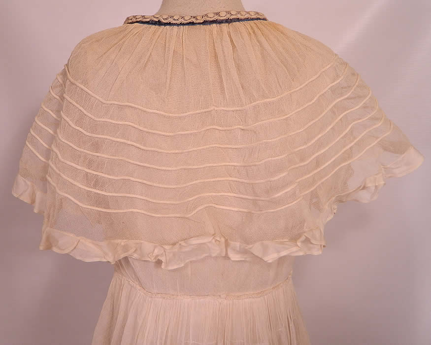 Vintage Crinoline Maid Edwardian White Net Lace Ruffle Shawl Collar Dress. It is in good condition, but has not been cleaned with some slight faint yellowing discoloration on the back collar and a few tiny pin holes in the net fabric. This is truly a wonderful piece of antique textile lace art which could be worn as a wedding gown! 