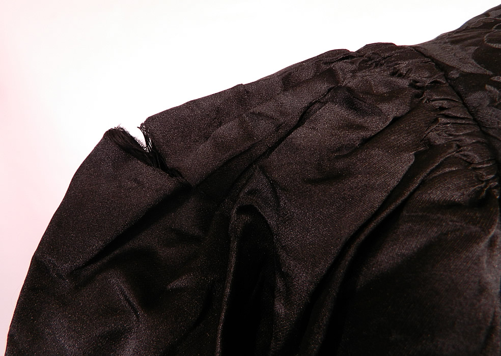 Victorian Black Silk Damask Brocade Gigot Mutton Sleeve Shirt Bodice. It is in good condition, with only a small fray on the top of each sleeve (see close-up).