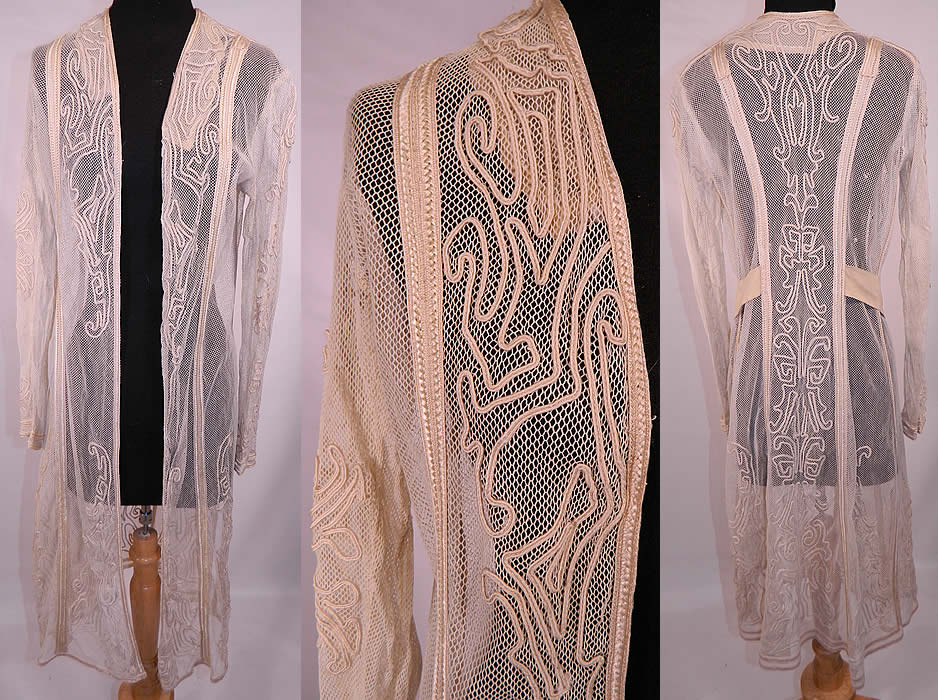 Edwardian Ecru Cream Net Soutache Work Walking Suit Jacket Coat. This exquisite antique Edwardian Titanic era ecru cream net soutache work walking suit jacket dates from 1912. It is made of a sheer off white ecru cream color net fabric, with raised ecru soutache stitched embroidery work done in a decorative spiral scrolling design pattern.This stunning summer walking suit long duster style coat jacket has an open front with no closure, an attached back cream fine wool belt sash with hook closure front, long tapered sleeves and is sheer and unlined. 