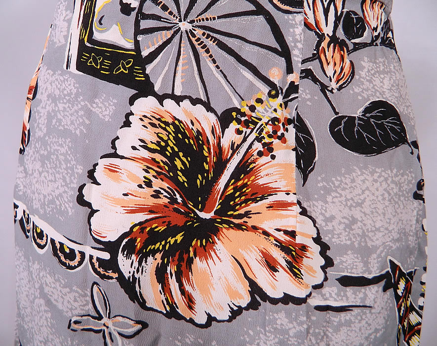 Vintage Surfriders Sportswear Hawaiian Hibiscus Print Rayon Strapless Sarong Dress. This retro Hawaiian sexy sarong style strapless wiggle dress is form fitting, with a wrap skirt side tie, side zipper closure and lined with stays boning sewn inside the bodice.