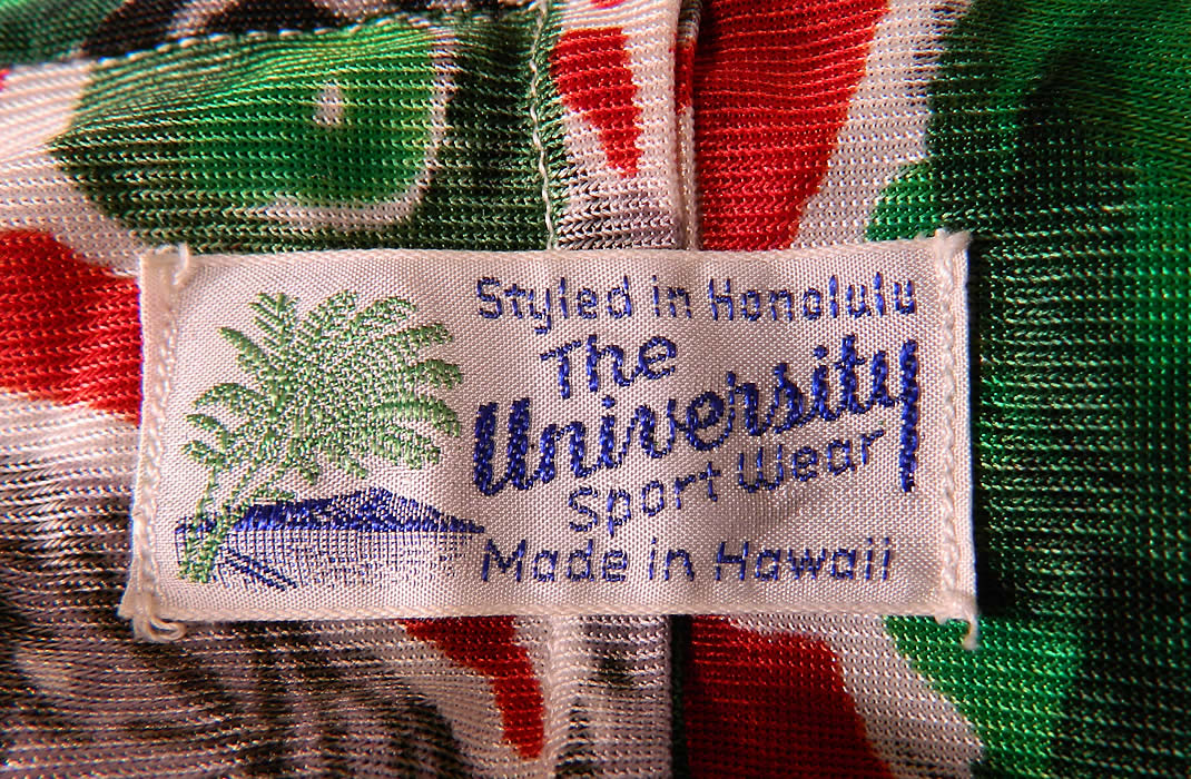 Vintage University Sport Wear Hawaii Apple Cherry Print Rayon Belted Kimono Robe. There is "The University Sport Wear Styled in Honolulu Made in Hawaii" label sewn inside. The kimono measures 68 inches long, with 48 inch hips, a 48 inch waist, 48 inch bust and 25 inch long sleeves. It is in good condition. This is truly a wonderful piece of collectable Hawaiiana vintage textile art! 