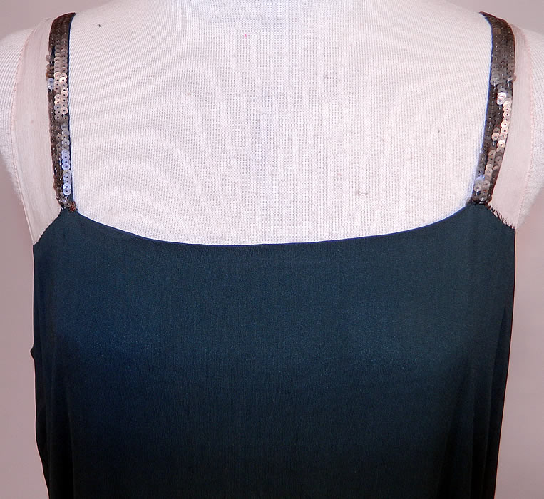 Vintage Green Silk Pink Sequin Beaded Floral Drop Waist Flapper Dress Slip
It is made of a dark forest green silk fabric, with a colorful pink, purple, green, gold and silver sequin beaded lush floral designs along the bottom skirt. 