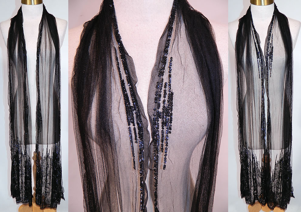 Vintage Art Deco Black Net Sequin Beaded Flapper Neck Boa Scarf Shawl Stole
This vintage Art Deco black net sequin beaded flapper neck boa scarf shawl stole dates from the 1920s. It is made of a black sheer net fabric, with black sequin beaded trim edging and bottom ends.