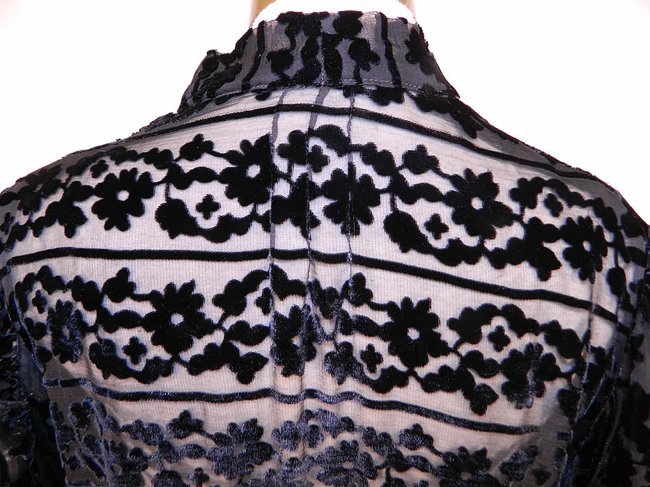 Vintage Black Floral Burnout Voided Velvet Silk Smocking Bias Cut Dress
The dress measures 48 inches long, with 40 inch hips, a 32 inch waist, 40 inch bust and 15 inch back. It is in good condition, with only a slightly frayed neckline. This is truly a wonderful piece of wearable textile art! 