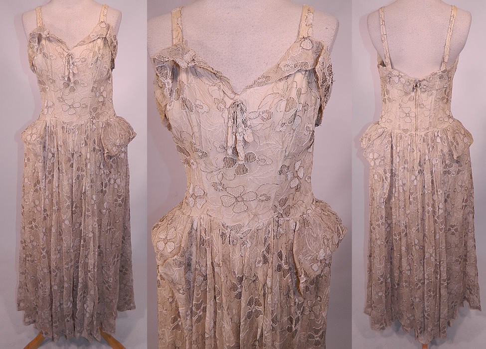 Vintage White Net Gold Lam&eacute; Lame Embroidered Pannier Peplum Skirt Gown Dress
This vintage white net gold lam&eacute; embroidered pannier peplum skirt dress dates from the 1940s. It is made of an off white ivory cream color sheer net fabric, with white and gold metallic lam&eacute; thread woven through, embroidered and outlining the floral leaf pattern design. 