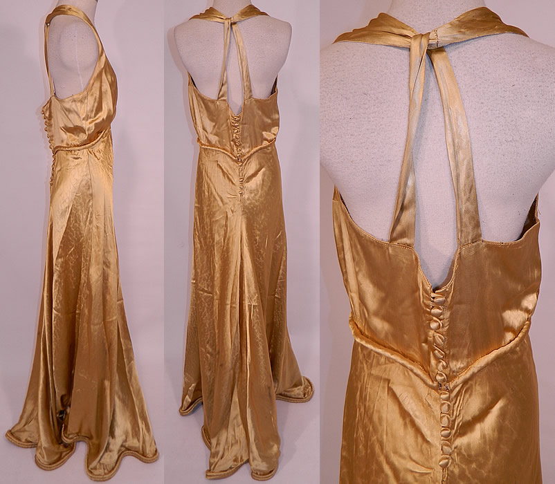 Vintage Hollywood Glam Gold Silk Satin Sexy Bias Cut Dress Evening Gown
This gorgeous gown has a sexy fitted bias cut style, with a long full floor length skirt, rolled padded hemline, halter top, sleeveless, backless, with a twisted loop strap back, plunging V front neckline, silk covered buttons on the back for closure and unlined. The dress measures 67 inches long, with 42 inch hips, a 30 inch waist and 38 inch bust. 