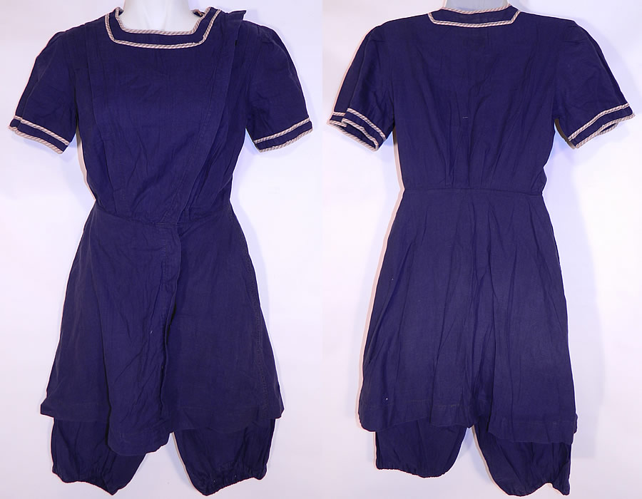 Vintage Water Sprite Edwardian Blue Bathing Suit Swimsuit Dress & Bloomers
This vintage Water Sprite Edwardian era blue bathing suit swimsuit dress and bloomers dates from 1910. It is made of a navy blue cotton fabric, with a tan & white stripe trim edging around the neckline collar and sleeve cuffs. 