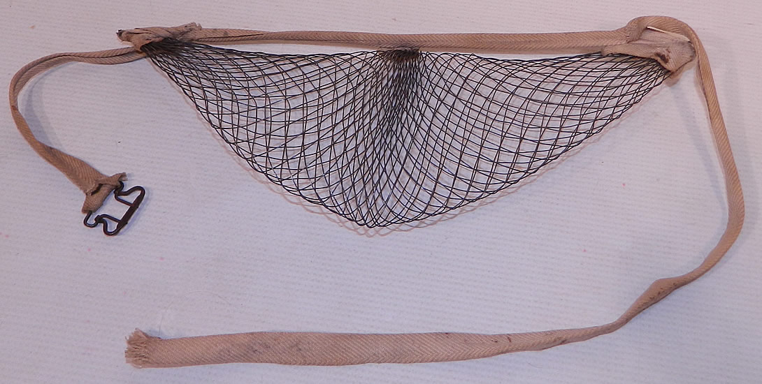 Victorian Antique Woven Wire Mesh Pillow Crescent Crinolette Bustle Pad Support
The bustle pad measures 11 by 5 inches, with a 34 inch waist. It is in good condition, with only some minor wear. This is truly a rare and wonderful piece of wearable Victoriana art!