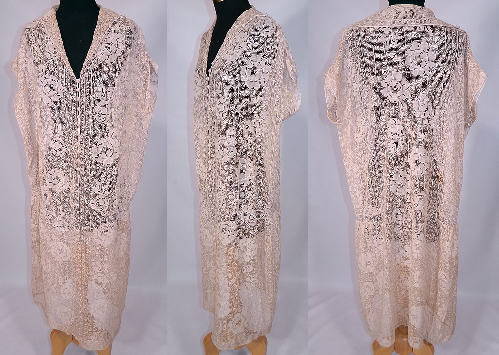 Vintage Ecru Cream Crochet Filet Lace Button Trim Drop Waist Dress
This exquisite vintage ecru cream crochet filet lace button trim drop waist dress dates from the 1920s. It is made of an off white ecru cream color sheer fishnet crochet filet lace fabric with a floral rose leaf and spiral scroll work design pattern. 