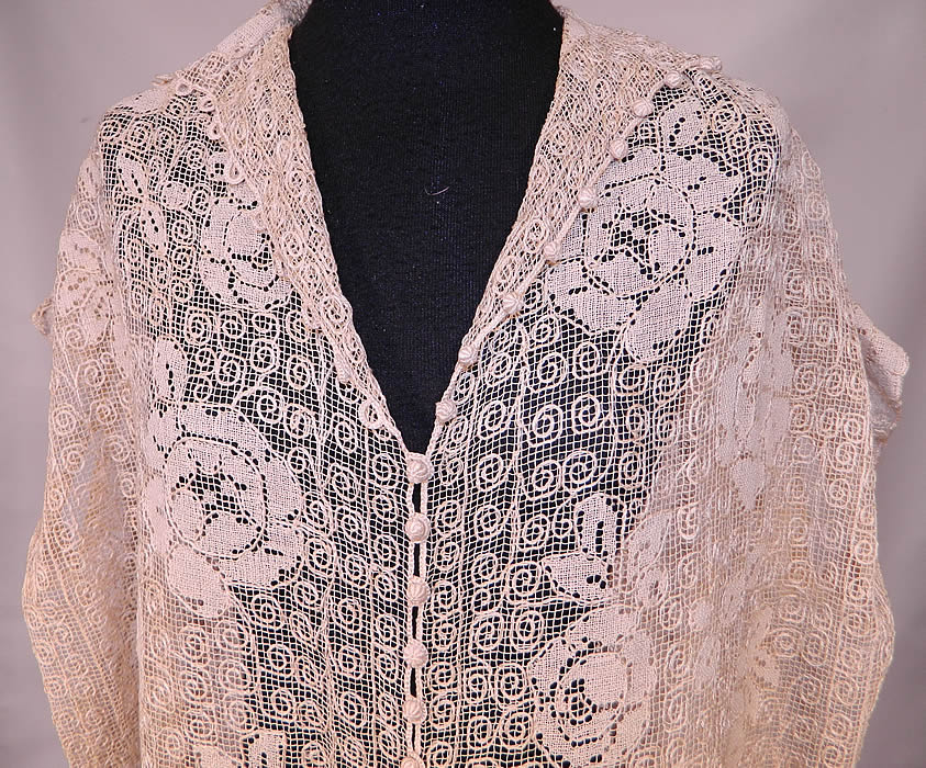 Vintage Ecru Cream Crochet Filet Lace Button Trim Drop Waist Dress
This lovely lace boho dress is loose fitting, a drop waist style, with short cap sleeves, a fold over collar, V neckline, tiny round crochet buttons down the front for closure and is sheer, completely unlined. 