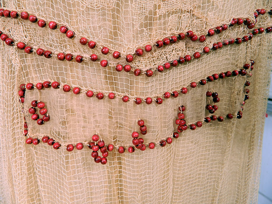 Vintage Cream Crochet Filet Lace Wood Beaded Rosette Drop Waist Flapper Dress
It is in good condition, with only a few missing, loose beads and some tiny holes on the back net skirt and waist area (see close-up). This is truly a rare and wonderful piece of wearable lace art! 