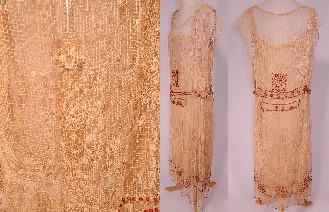 Vintage Cream Crochet Filet Lace Wood Beaded Rosette Drop Waist Flapper Dress
The dress measures 50 inches long, with 40 inch hips, a 34 inch waist and 36 inch bust.