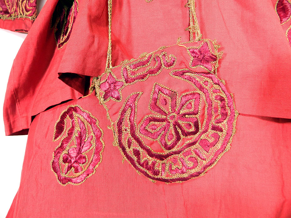 Ottoman Turkish Tugra Red Silk Gold Embroidered Jacket Harem Pant Belted Purse Outfit

There are embroidered paisley boteh designs, flowers, stars, crescent moons, Arabic lettering and the Tugra of Mehmed VI the 36th and last sultan of the Ottoman Empire on the back jacket, pant leg cuffs. There is an embroidered sash belt with no closure, measuring 36 inches long and 3 inches wide. Also included is a small pouch purse with a gold carrying strap on top and measures 5 by 5 inches.