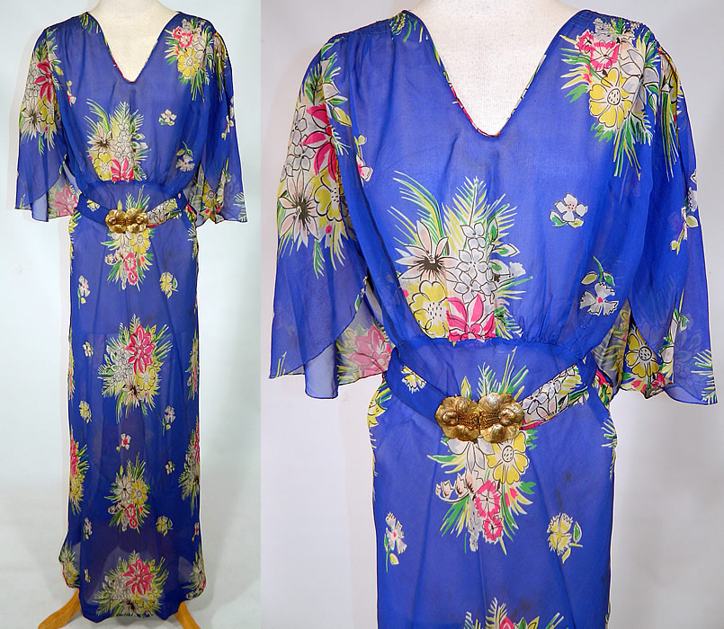 Vintage Blue Silk Chiffon Floral Bouquet Print Belted Bias Cut Dress. 
This vintage blue silk chiffon floral bouquet print belted bias cut dress dates from the 1930s. It is made of a bright royal blue color sheer silk chiffon fabric, with a colorful floral bouquet print pattern design.