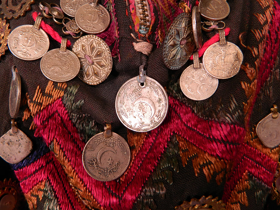 Swat Valley Pakistan Coin Beaded Embroidered Ethnic Tribal Bib Front Fabric Top
This beautiful tribal top bib front decorated panel would have been part of a kaftan style wedding dress which has been cut now resembling a backless halter top with a zipper closure front neck, no back and is lined in a floral print fabric. 