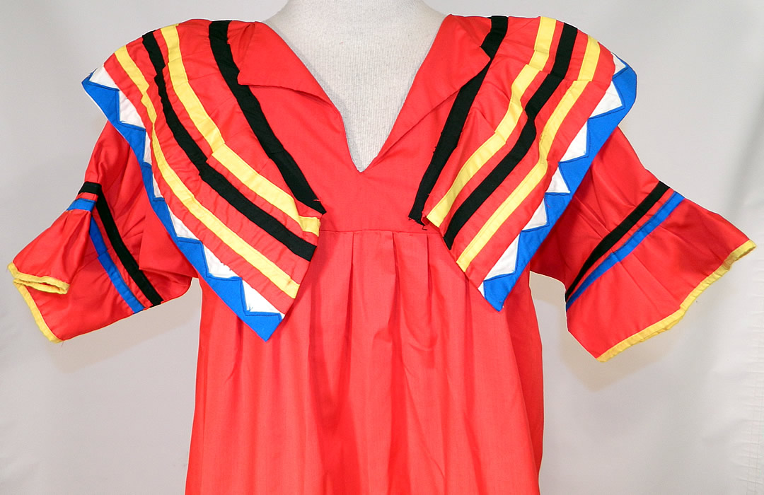 Vintage Seminole Native American Indian Sawtooth Patchwork Colorful Boho Maxi Dress
This beautiful boho tribal maxi dress is a long floor length, with a loose fitting style, shawl collar and short sleeves with ruffle cuffs. 