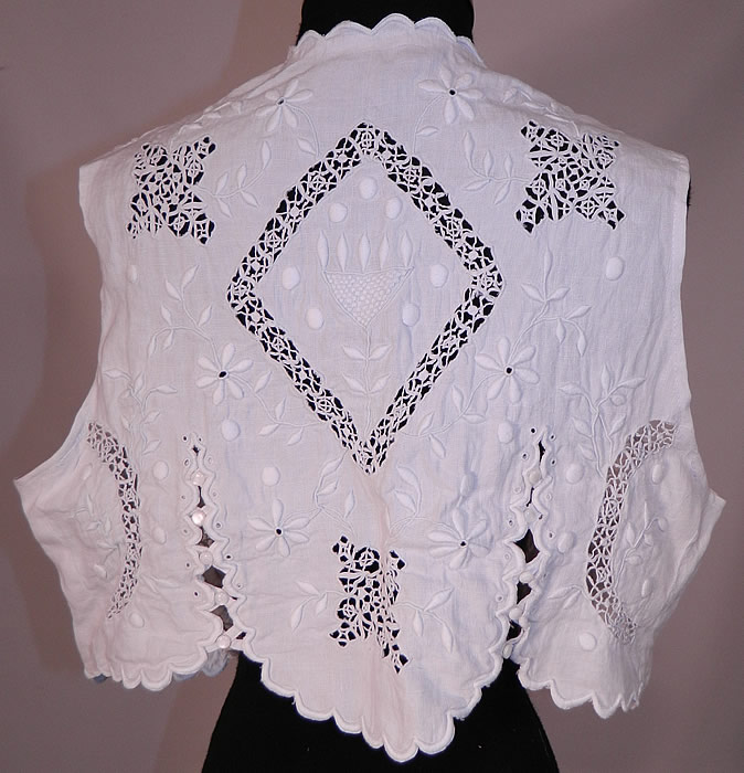 Edwardian White Linen Eyelet Embroidered Drawn Cut Work Lace Blouse Vest Top
This sensational summer sleeveless vest style blouse has an open front with a single button strap closure across the front and decorative scalloped slit opening sides and back with tiny button closures.