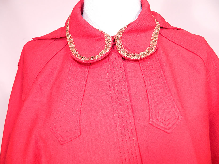 Edwardian Red Wool Gold Metallic Trim Collar Winter Cloak Cape
This red wool winter cloak cape is mid length, has a rounded fold over front collar with shawl collar back, white silk lining inside and a hook closure at the neck. 