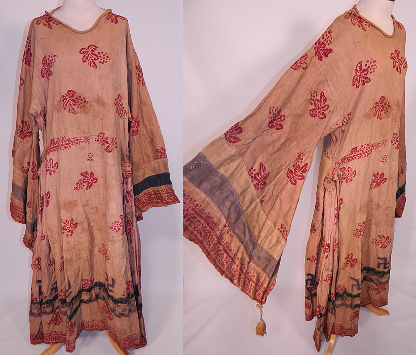 Antique 19th Century Nepalese Nepal Hindu Lakhe Mask Dance Dress Kimono Sleeve
This antique Nepalese Nepal Hindu Lakhe Mask Dance dress with kimono sleeves dates from the late 19th century. It is made of a hand woven muslin fabric with natural dyes and a wood block print of grape leaf and swastika designs.
