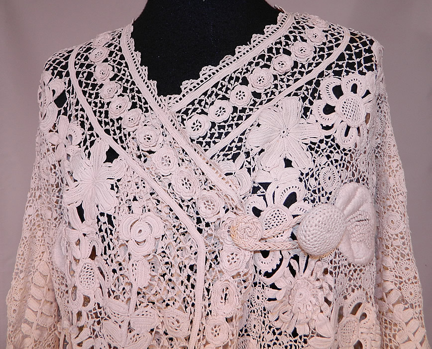Vintage Edwardian Antique White Irish Crochet Lace Embroidered Long Coat Jacket
It is made of an off white ivory cream color Irish crochet lace with raised three dimensional flower, leaf designs, connecting thread picot ornamented bars, detailed meshwork and large raised padded satin stitch, French knot embroidery work flowers. 