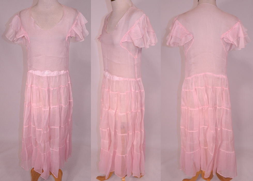 Vintage Pink Pastel Pink Organdy White Embroidered Star Applique Party Dress
This vintage pink pastel organdy white embroidered star appliqu&eacute; party dress dates from the 1930s. The dress measures 45 inches long, with 42 inch hips, a 30 inch waist and 34 inch bust. 