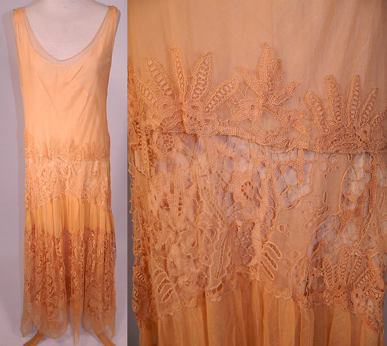 Vintage Peach Net Battenburg Lace Drop Waist Dress Silk Slip & Jacket Outfit
This lovely lace dress is loose fitting, with a drop waist, sleeveless. with low scoop necklines, a slight high low handkerchief style skirt hem and is sheer, unlined. 
