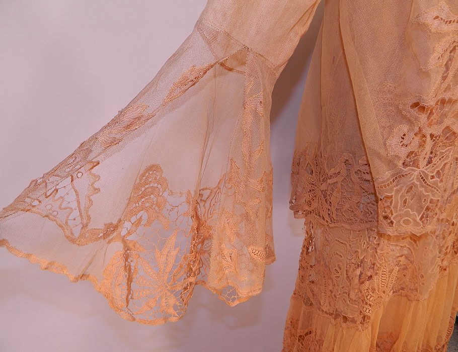 Vintage Peach Net Battenburg Lace Drop Waist Dress Silk Slip & Jacket Outfit
The dress measures 56 inches long, with 40 inch hips, a 30 inch waist and 32 inch bust. There is a matching net lace fabric jacket, with a loose fitting long mid length style, open front, no closure, long sleeves with wide flared open slit cuffs and is sheer, unlined. 
