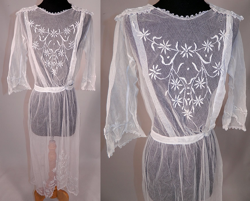 Vintage Edwardian Sheer White Net Floral Embroidered Lace Middy Dress
This vintage Edwardian era sheer white net floral embroidered lace middy dress dates from 1915. It is made of a sheer fine white net, with raised padded satin stitch embroidery work done in a floral daisy vine leaf pattern design and scalloped ace trim edging.