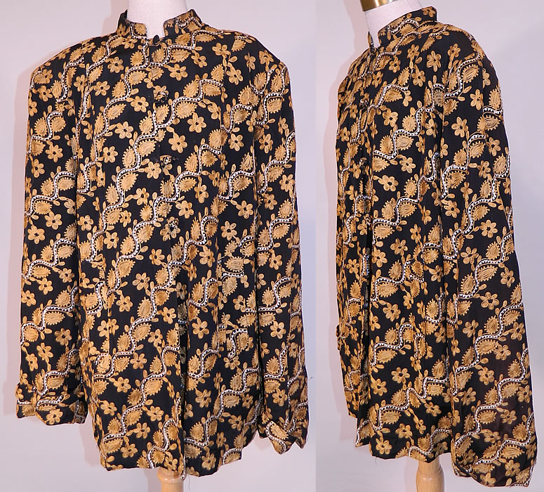 Vintage Black Silk Rayon Chain Stitch Crewel Work Embroidery Swing Coat Jacket.
This vintage black silk rayon chain stitch crewel work embroidery swing coat jacket dates from the 1940s. It is made of a black silk rayon blend fabric, with a golden yellow and white crewel work, chain stitch hand embroidered floral vine leaf, scalloped stripe diagonal design.