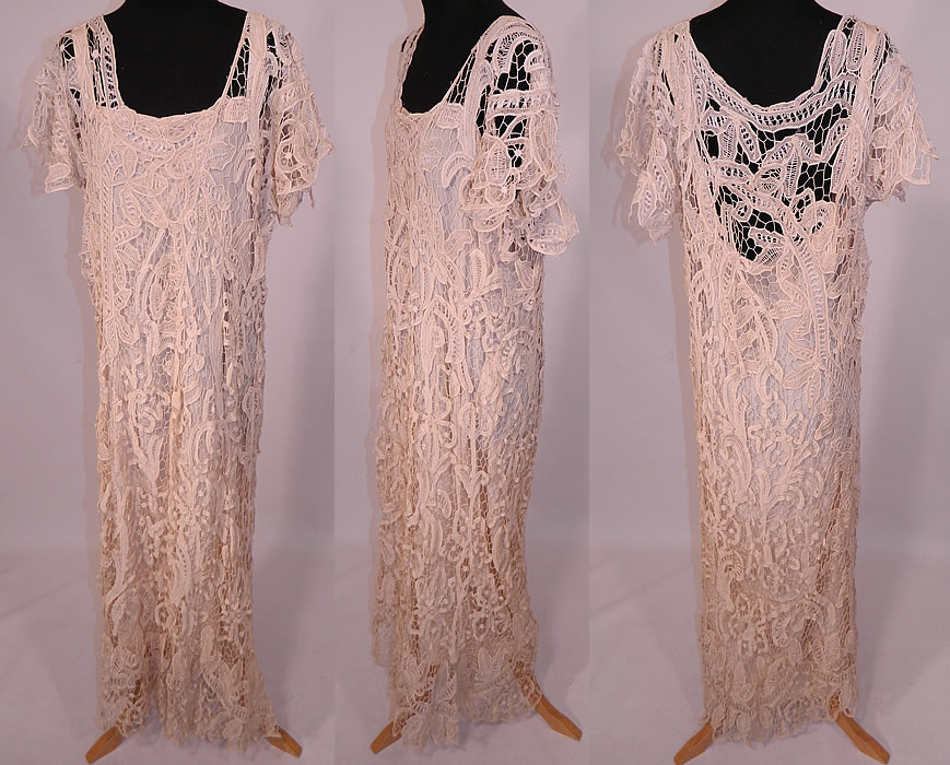 Vintage Cream Battenburg Needle Lace Wedding Gown Dress & Silk Slip
This vintage cream battenburg needle lace wedding gown dress and silk slip dates from the 1920s, perhaps reworked from an earlier Edwardian era dress. It is made of an off white cream color sheer needle made button hole stitches, with outlining cordonnets, connecting brides and bars, creating floral, leaf, scroll work decorative designs.