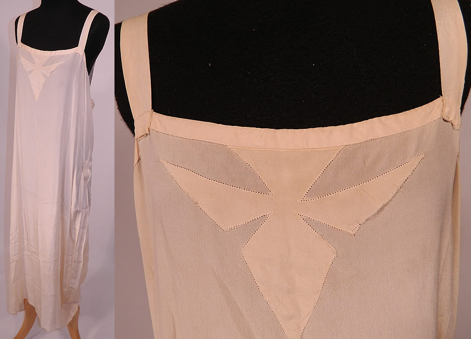 Vintage Cream Battenburg Needle Lace Wedding Gown Dress & Silk Slip
The dress measures 57 inches long, with 48 inch hips, a 40 inch waist and 40 inch bust. Included is a cream color silk chemise shift style slip with decorative stitching appliqu&eacute; work on the front neckline and a side gathering drape skirt. 