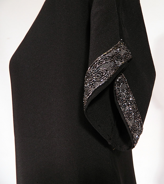 Vintage Art Deco Black Silk Crepe de Chine Tiered Panel Skirt Beaded Flapper Dress
The dress measures 40 inches long, with 36 inch hips, a 32 inch waist and 34 inch bust. It is in good condition. This is truly a wonderful piece of Art Deco wearable beaded textile art! 