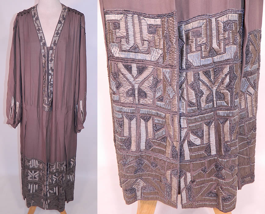 Vintage Art Deco Gray Silk Embroidered Silver Beaded Flapper Drop Waist Dress
This gorgeous vintage Art Deco gray silk embroidered silver beaded flapper drop waist dress dates from the 1920s. It is made of a dark gray silk fabric, with varying shades of gray raised padded satin stitch hand embroidery work done in an Arts & Crafts geometric designs, with silver beaded accents and gray silk tassel fringe trim along the shoulders.