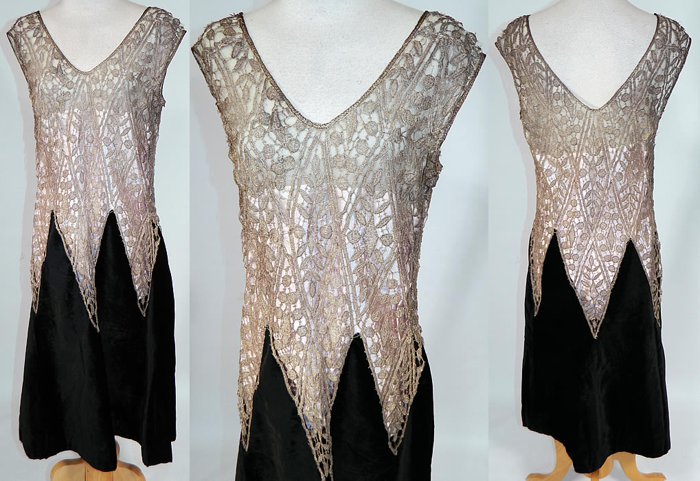 Vintage Silver Lam&eacute; Lame Lace Black Velvet Drop Waist Flapper Dress
This vintage Art Deco silver lam&eacute; lace black velvet drop waist flapper dates from the 1920s. It is made of silver lam&eacute; metallic thread woven into a sheer lace berry leaf pattern design on the top and a black silk velvet fabric skirt bottom. This fabulous flapper dress has a drop waist, short skirt, sleeveless, with plunging V necklines and a lined top only.
