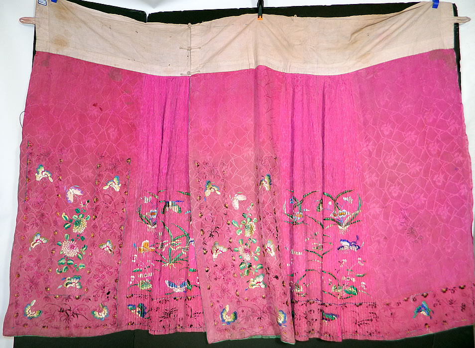 Antique Chinese Fuchsia Purple Silk Embroidered Butterfly Han Wedding Skirt
The skirt has two matching embroidered apron panels on the front and back, with butterfly, vine leaf flowers embroidered hidden inside the pleated sides. This Han womens wedding early wrap around style apron skirt has a wide linen waistband sewn along the top. 