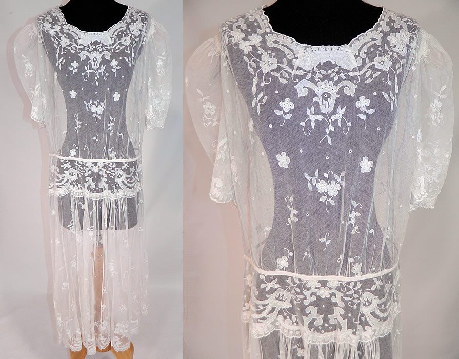 Vintage White Tambour Embroidery Lace Sheer Silk Tulle Net Drop Waist Dress
This vintage white tambour embroidery lace sheer silk tulle net drop waist dress dates from the 1920s. It is made of a white sheer silk tulle net lace fabric with fine tambour stitch embroidery work done in a floral vine leaf, polka dot pattern design.