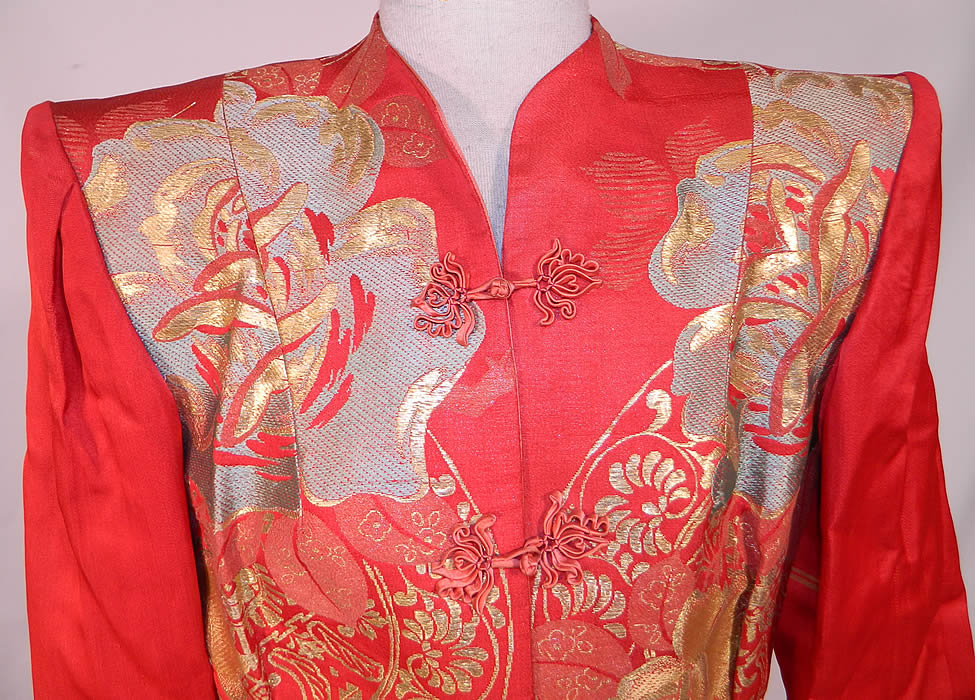 Vintage Japanese Kimono Obi Red Silk Gold Lame Broad Shoulder Jacket Lam&eacute;
This quality made jacket has a tailored fitted style, with exaggerated broad shoulder padding, long full sleeves with wide cuffs, red silk knotted button toggle closures down the front and is fully lined.