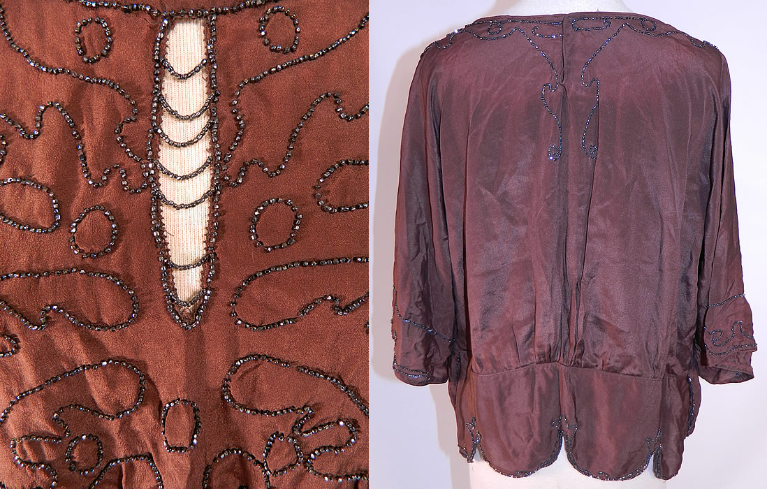 Vintage Art Deco Brown Silk Silver Beaded Flapper Blouse Shirt Top
This beautiful beaded blouse has a long loose fitting style, with a scalloped beaded trim edging skirted bottom hem, peek-a-boo keyhole beaded strand front opening, 3/4 length long full sleeves and snap closures on the back neck. The top measures 20 inches long, with a 34 inch waist and 46 inch bust. It is in good condition. This is truly a wonderful piece of wearable Art Deco textile art! 