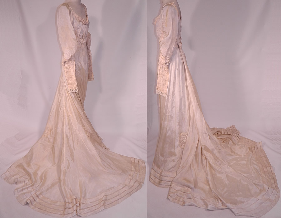 Edwardian Cream Silk Ruched Pearl Beaded Lace Trim Wedding Gown Train Skirt Dress
This beautiful bridal wedding gown dress has a renaissance medieval style, with a very long back train skirt, exaggerated long tapered sleeves, an empire waist, low rounded scoop neckline, hook closures on the back and a white cotton lace ruffle petticoat underskirt with slight back train has been sewn inside lining the skirt. 
