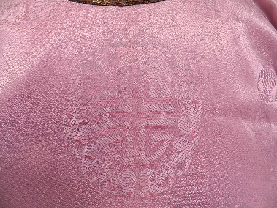 Antique Chinese Character Embroidered Purple Lilac Silk Damask Brocade Robe
The robe measures 30 inches long, with a 44 inch waist and 44 inch chest. It is in good as-is condition, with some fade discoloration in areas. This is truly a wonderful piece of wearable antique Chinese art!