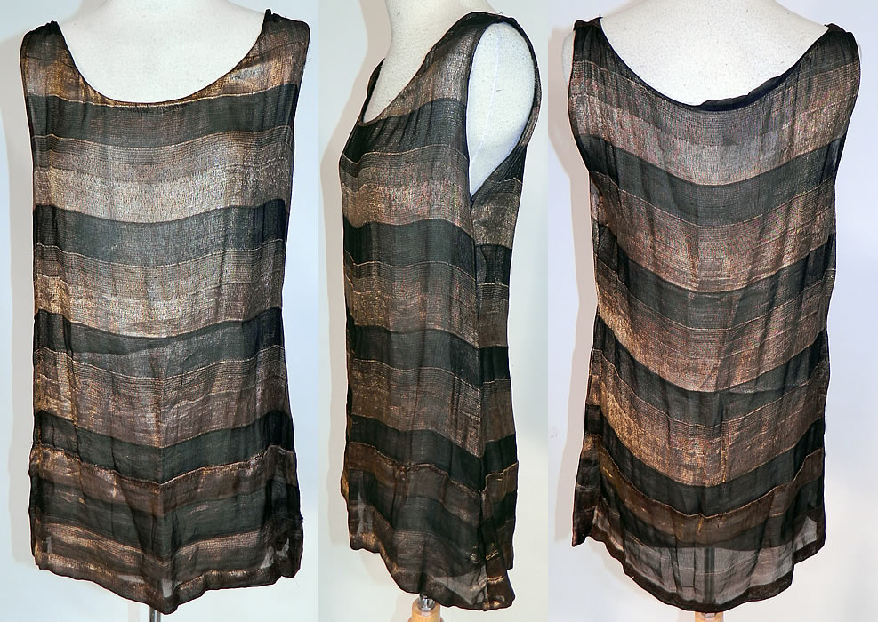 Vintage Art Deco Black & Gold Lame Silk Stripe Flapper Tunic Top Dress Lam&eacute;
This vintage Art Deco black and gold lam&eacute; silk stripe flapper tunic top dress dates from the 1920s. It is made of a black and gold lam&eacute; sheer silk chiffon fabric with a striped pattern design. This fabulous flapper tunic top style sleeveless mini dress is sheer and unlined. 