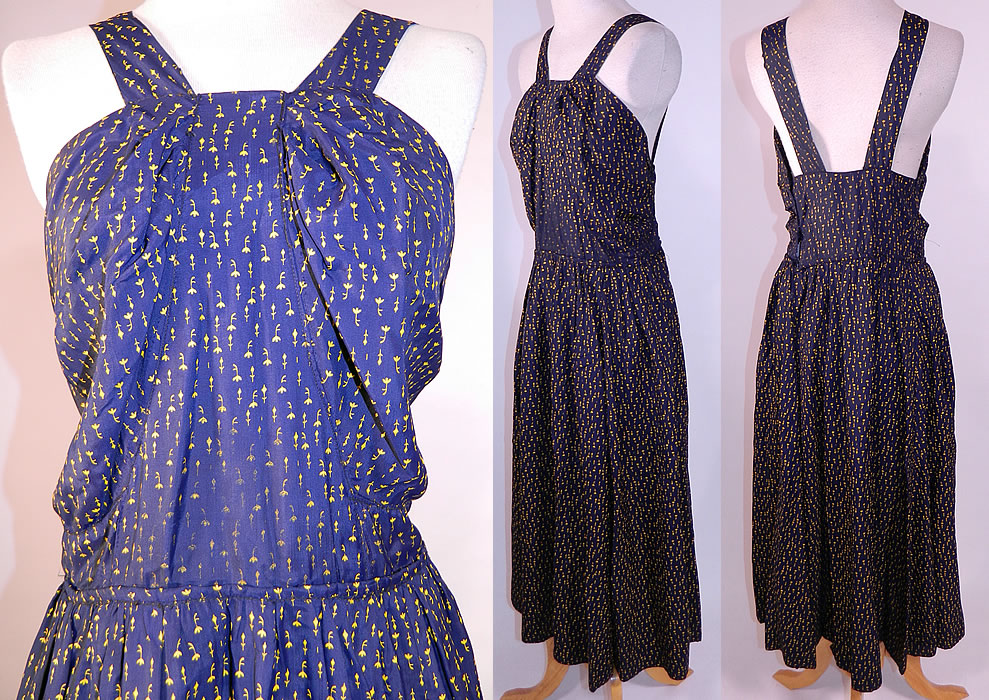 Vintage Navy Blue Yellow Sunflower Novelty Print Silk Sun Dress & Jacket
The dress measures 48 inches long, with a 26 inch waist and 32 inch bust. There is a matching fabric short cropped bolero style jacket, with gathered shoulders, short sleeves, sunflower appliqu&eacute; trim back and snap closure at the waist. 