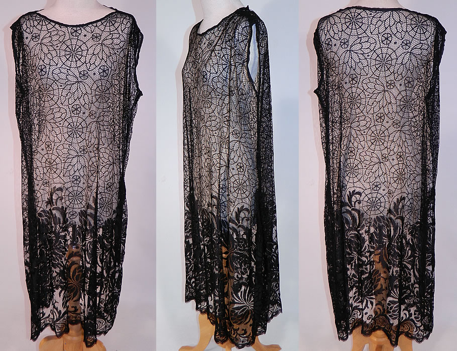Vintage Black Spider Cob Web Lace Net Floral Pattern Drop Waist Flapper Dress
This vintage black spider cob web lace net floral pattern drop waist flapper dress dates from the 1920s. It is made of a sheer black fine silk net lace fabric, with a spider cob web leaf pattern top and shaded floral pattern bottom skirt.