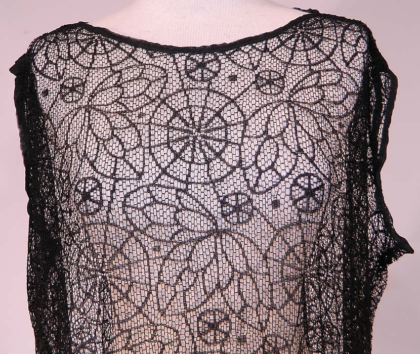 Vintage Black Spider Cob Web Lace Net Floral Pattern Drop Waist Flapper Dress
This fabulous flapper dress has a loose fitting drop waist sleeveless style, with scalloped bottom skirt and is sheer completely unlined.