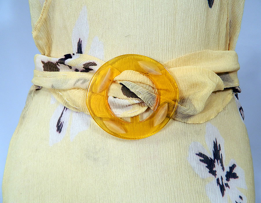 Vintage Yellow Silk Chiffon Black Floral Print Belted Bias Cut Dress & Jacket
This beautiful bias cut dress is a long floor length, with a fitted backless style, plunging V necklines, a matching fabric tie sash belt with butterscotch yellow lucite buckle, no side opening closures and is sheer completely unlined.