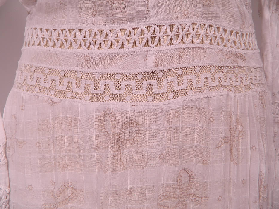 Edwardian White Window Pane Cotton Batiste Bow Polka Dot Print Fabric Lace Trim Dress
This beautiful bow lace trim dress is a long floor length, with a high neck lace collar, lace trim yoke top, long sleeves with flared lace cuffs, a fitted waist, mother of pearl buttons, hook closures down the back and is sheer, unlined. 