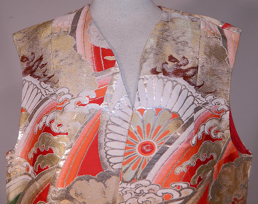 Vintage Japanese Gold Silk Lam&eacute; Lame Ocean Waves Obi Fabric Sleeveless Vest Jacket
This elegant evening vest sleeveless jacket is a long floor length, with a loose fitting style, side skirt slits for easy movement, an open front with no closure and is fully lined in a reddish orange silk fabric inside. 
