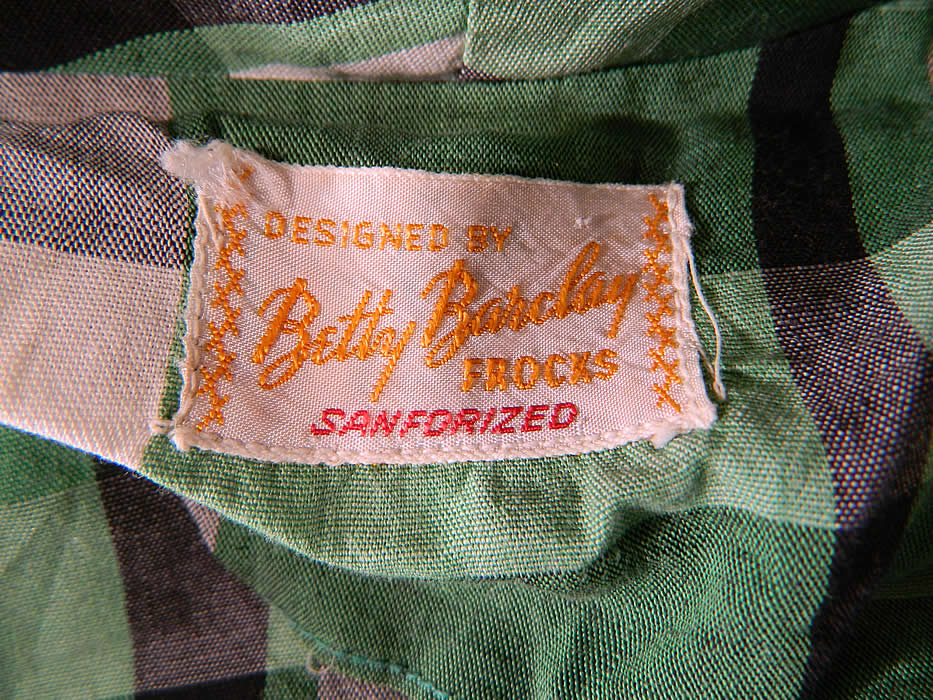 Vintage Betty Barclay Frocks Green Gingham Check Cotton Circle Skirt Dress & Jacket
There is a "Designed By Betty Barclay Frocks Sanforized" label sewn inside. The dress measures 43 inches long, with 34 inch hips, a 24 inch waist and 34 inch bust. 